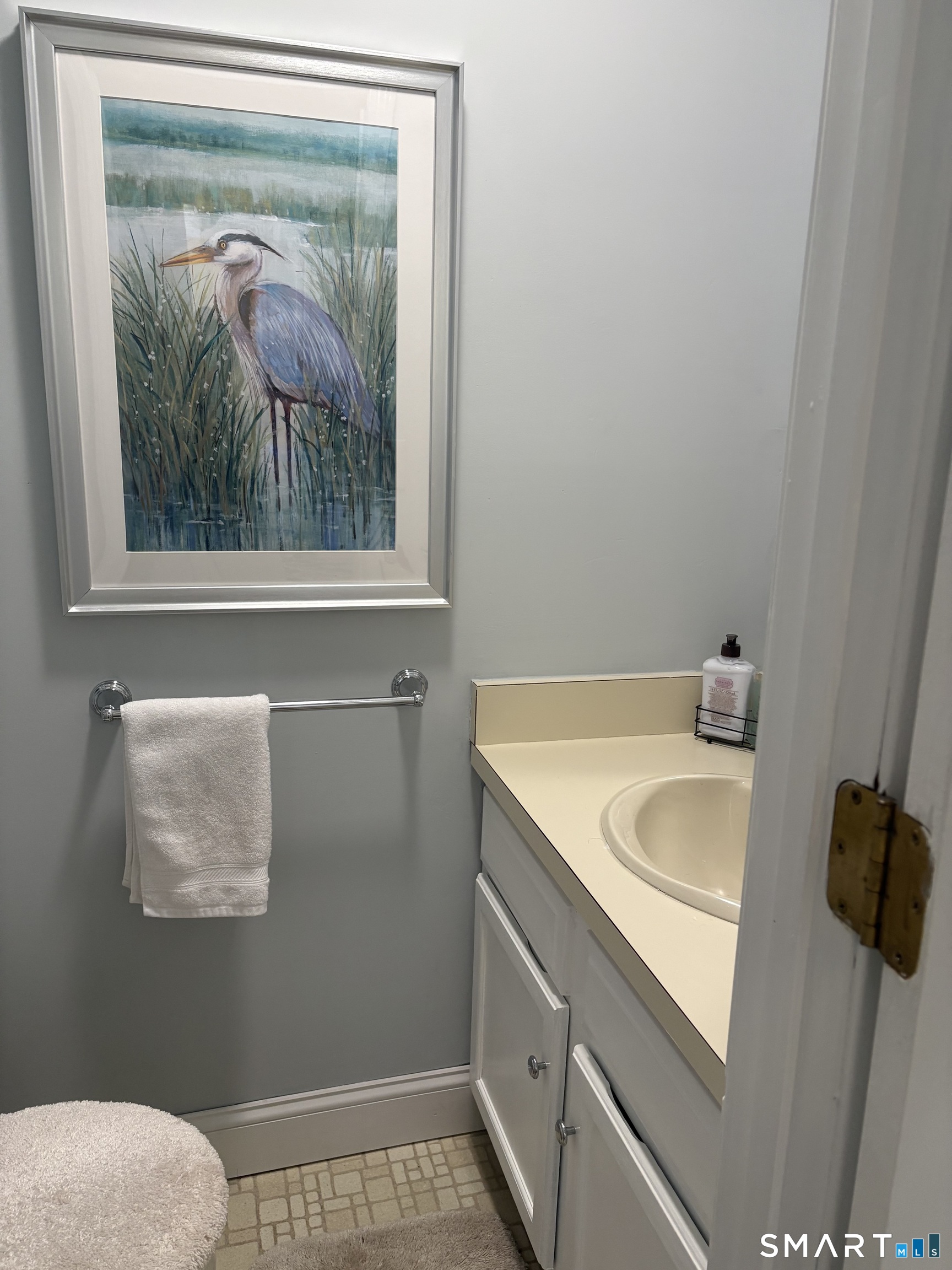 32 Upper Pattagansett Road, Unit 30 East Lyme, CT 06333 - Photo 20 of 28 a bathroom with a sink and a mirror