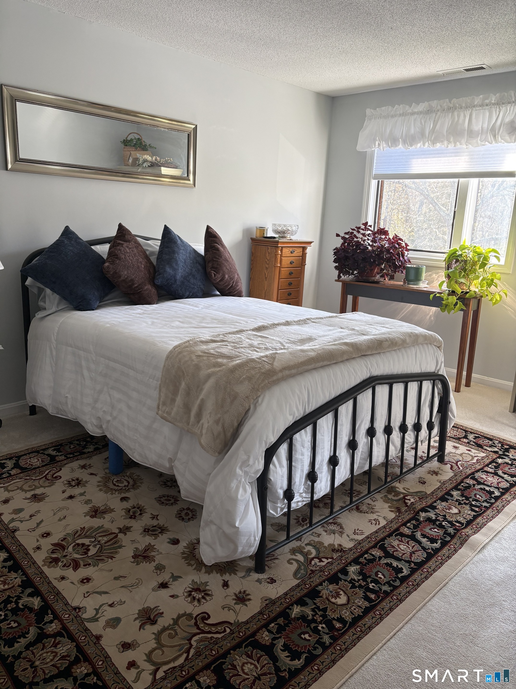 32 Upper Pattagansett Road, Unit 30 East Lyme, CT 06333 - Photo 22 of 28 a bedroom with a bed window and lamp