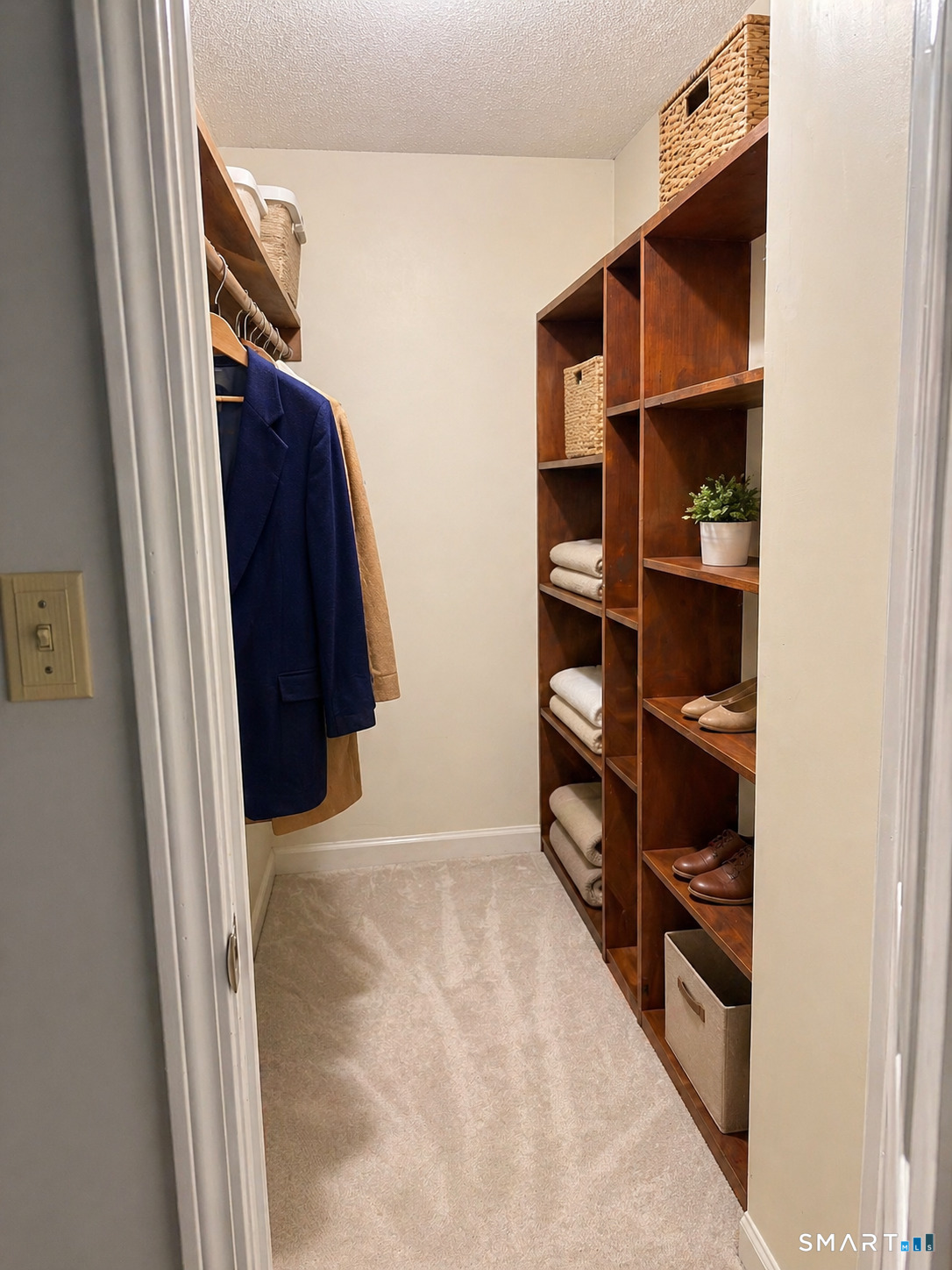 32 Upper Pattagansett Road, Unit 30 East Lyme, CT 06333 - Photo 27 of 28 a view of walk in closet with empty racks