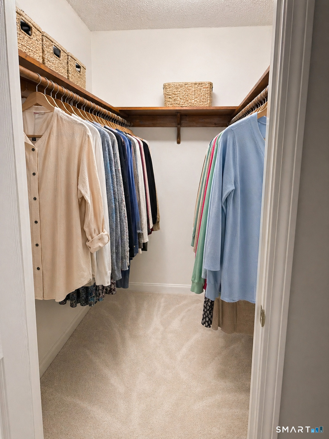 32 Upper Pattagansett Road, Unit 30 East Lyme, CT 06333 - Photo 28 of 28 a view of walk in closet with clothes and shoes
