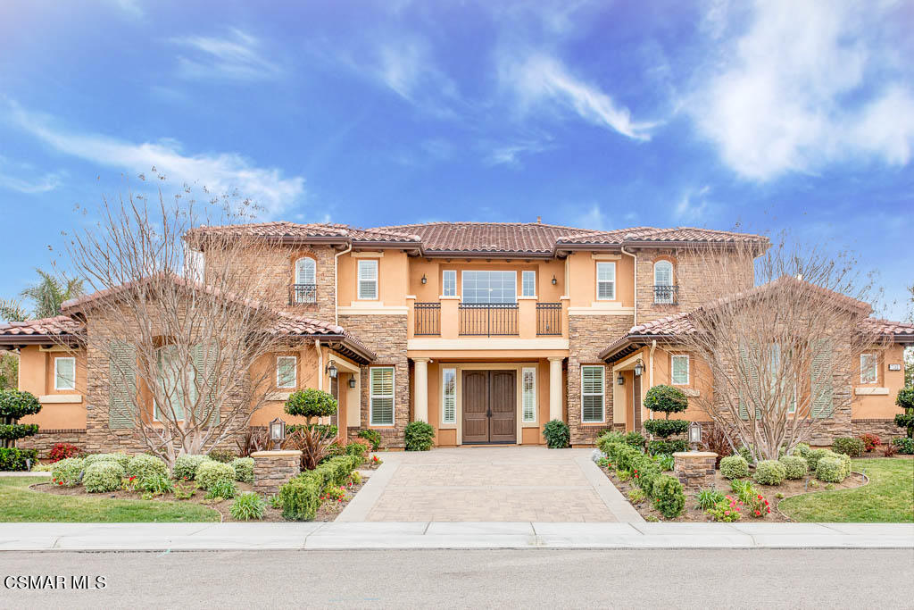 7342 Nicklaus Road Moorpark, CA 93021 - Photo 1 of 55 a front view of a residential apartment building with a yard