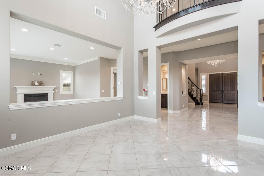 7342 Nicklaus Road Moorpark, CA 93021 - Photo 12 of 55 a view of a hallway with wooden floor and a living room