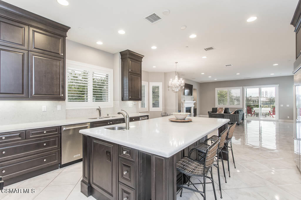 7342 Nicklaus Road Moorpark, CA 93021 - Photo 21 of 55 a kitchen with granite countertop a sink and cabinets