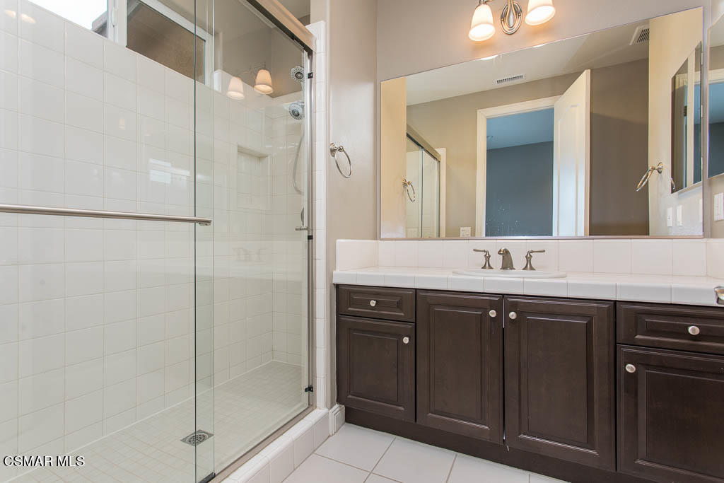 7342 Nicklaus Road Moorpark, CA 93021 - Photo 30 of 55 a bathroom with a sink and a mirror