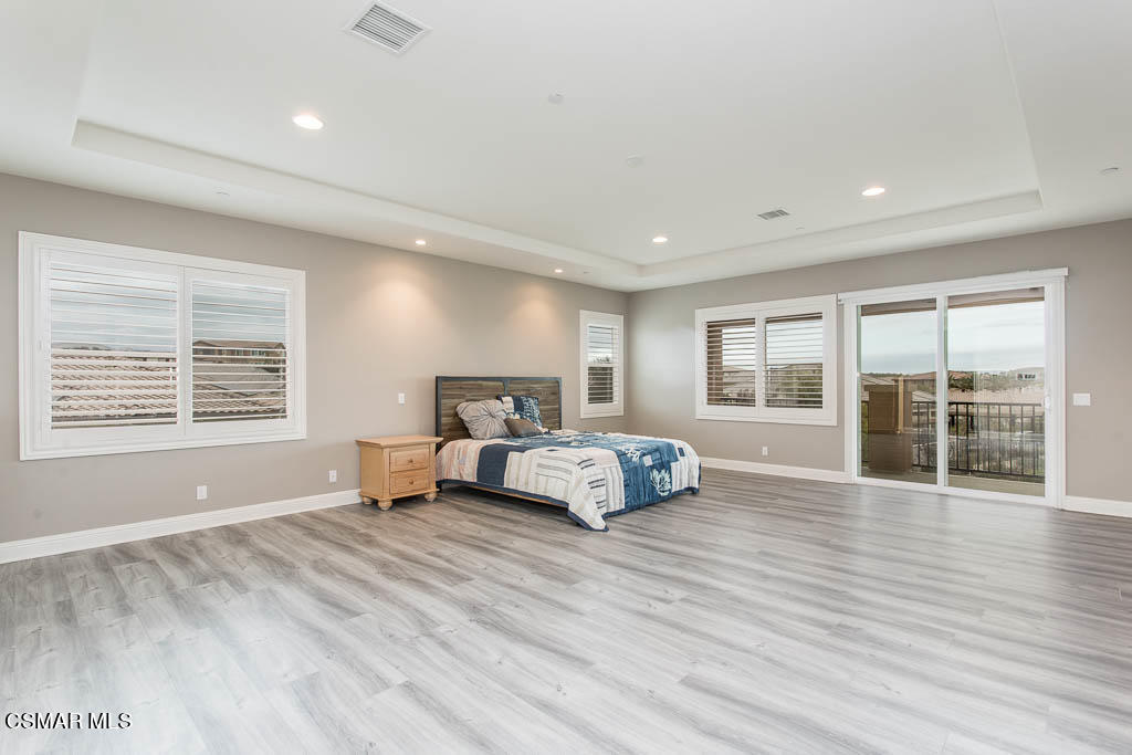 7342 Nicklaus Road Moorpark, CA 93021 - Photo 31 of 55 a spacious bedroom with a large bed and a large window