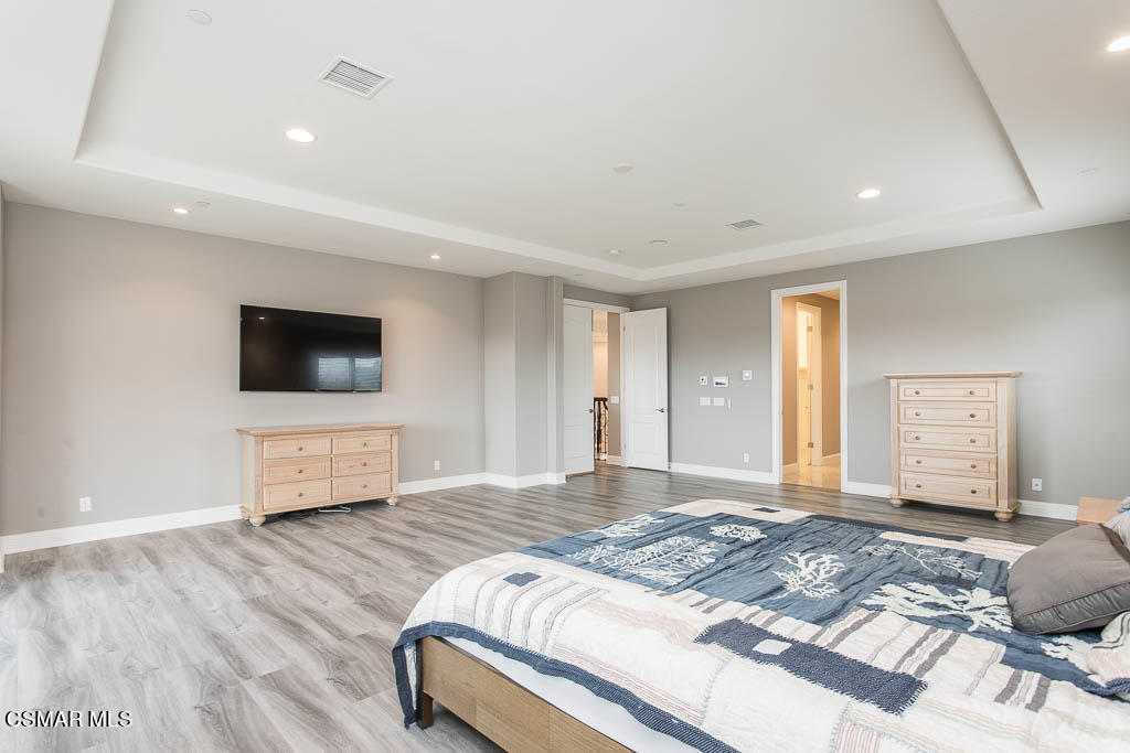7342 Nicklaus Road Moorpark, CA 93021 - Photo 32 of 55 a bedroom with a bed and a flat screen tv