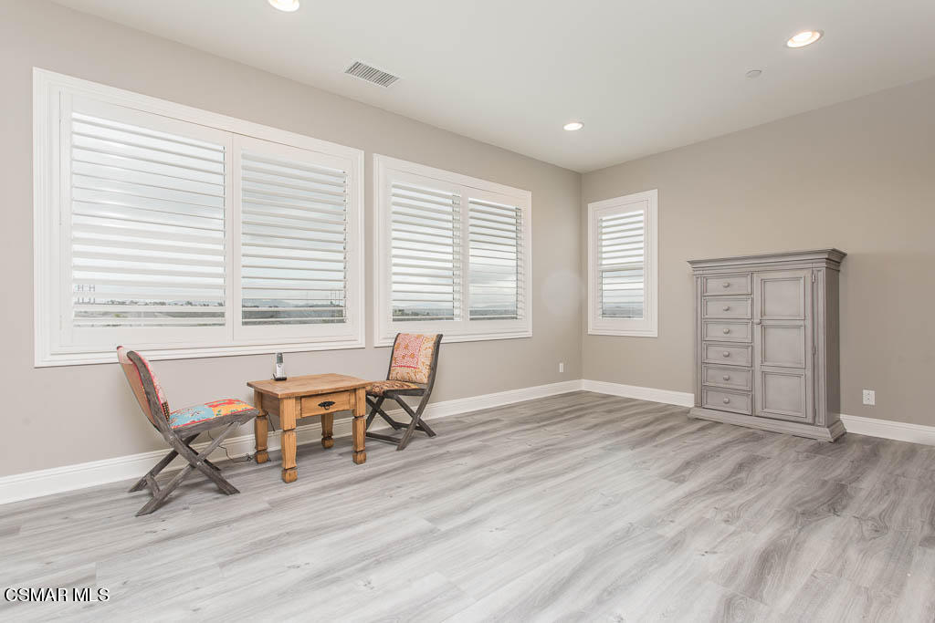 7342 Nicklaus Road Moorpark, CA 93021 - Photo 41 of 55 a view of a work space with wooden floor and furniture
