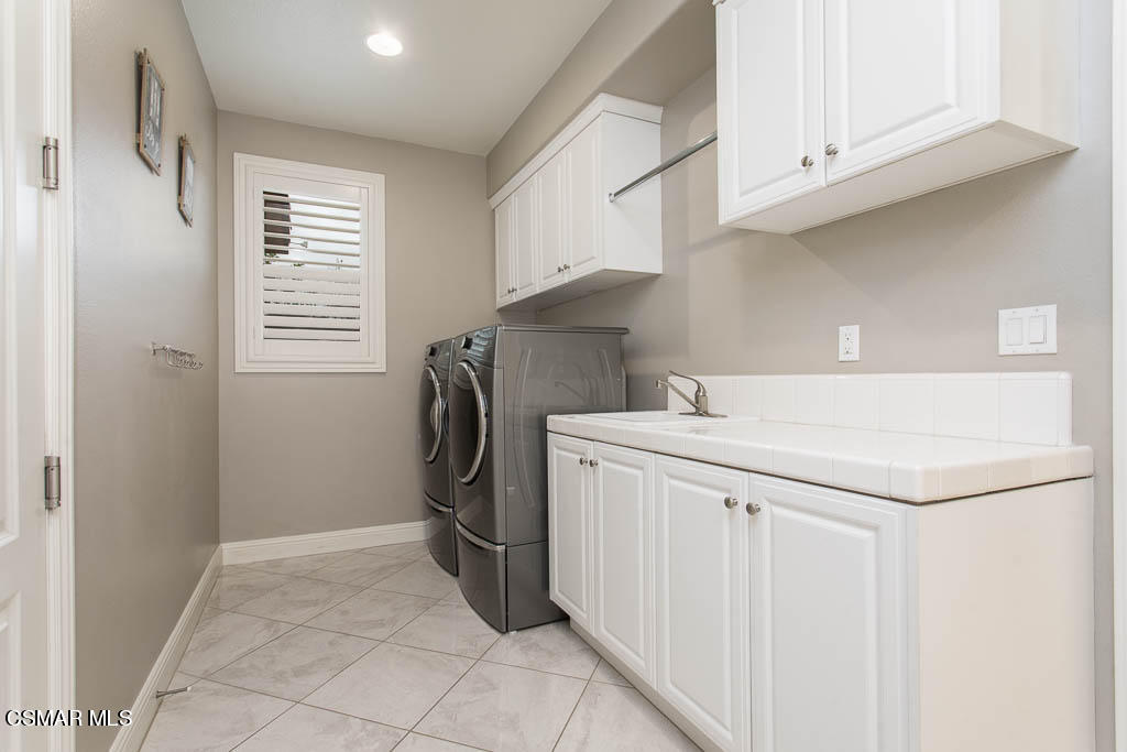 7342 Nicklaus Road Moorpark, CA 93021 - Photo 47 of 55 a utility room with dryer and washer