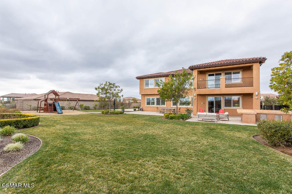 7342 Nicklaus Road Moorpark, CA 93021 - Photo 48 of 55 a front view of a house with garden