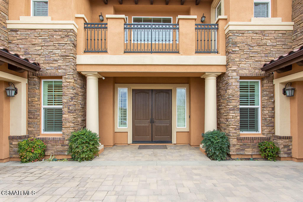 7342 Nicklaus Road Moorpark, CA 93021 - Photo 9 of 55 a front view of a house with a yard