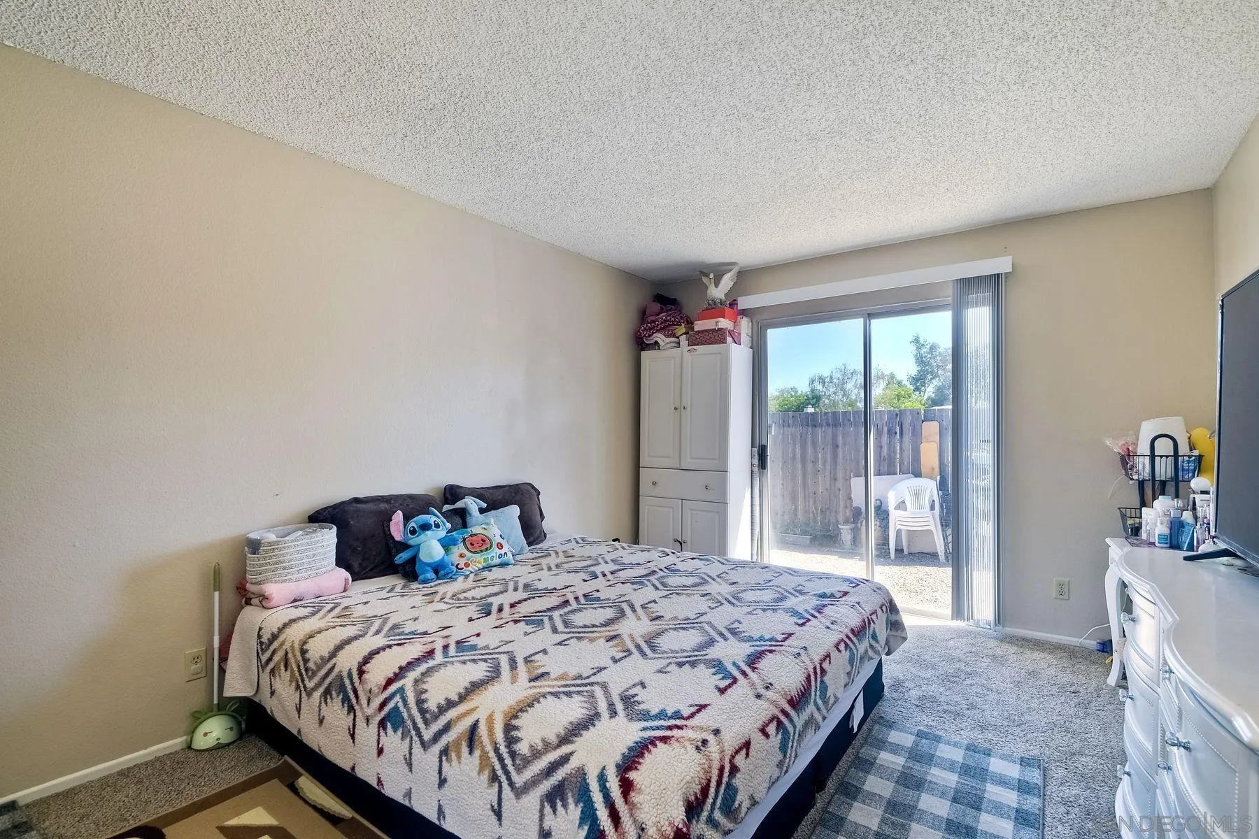 1160 Corral Glen Escondido, CA 92026 - Photo 12 of 16 a bedroom with a bed and large window