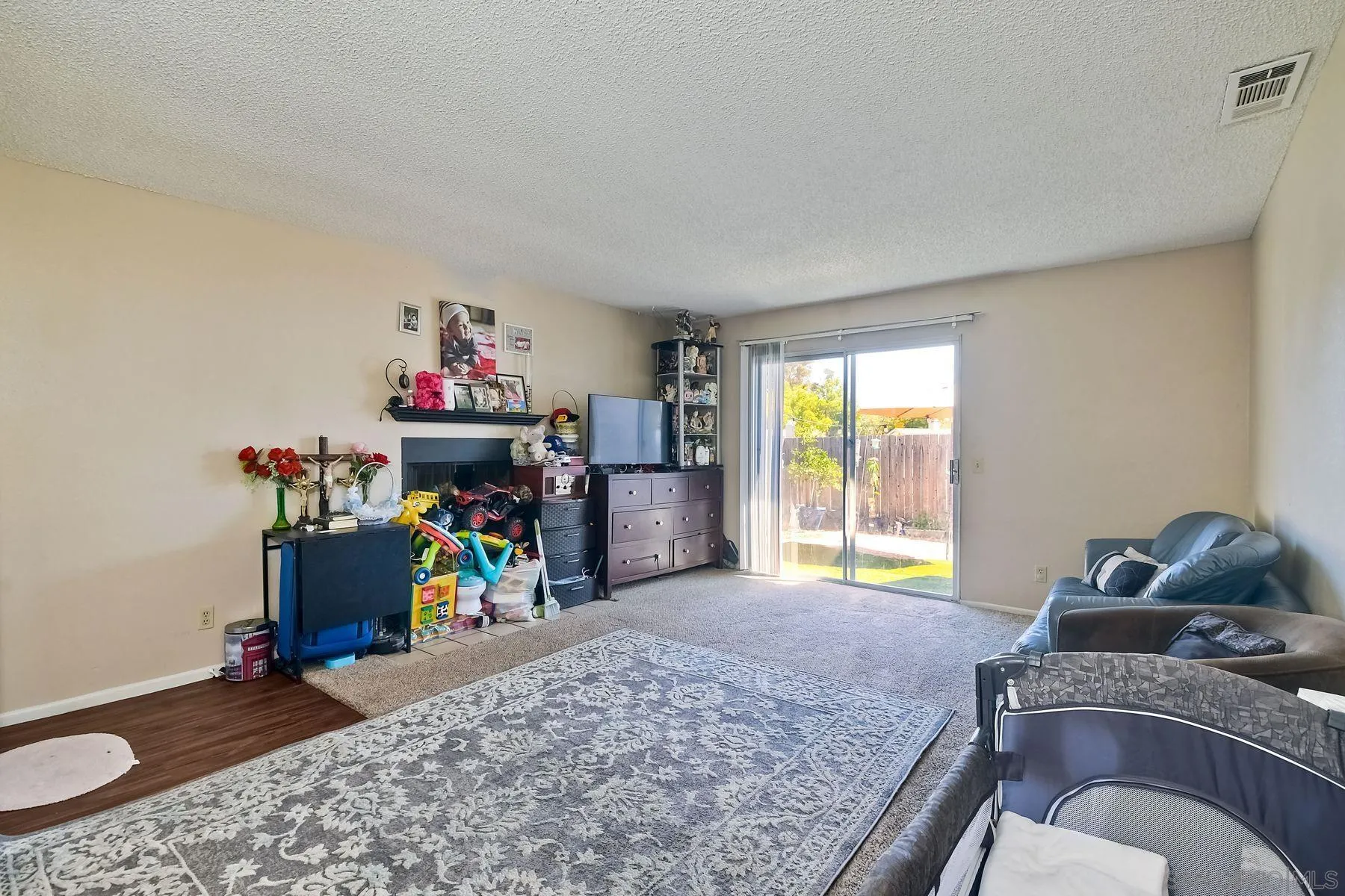 1160 Corral Glen Escondido, CA 92026 - Photo 3 of 16 a living room with furniture and a flat screen tv