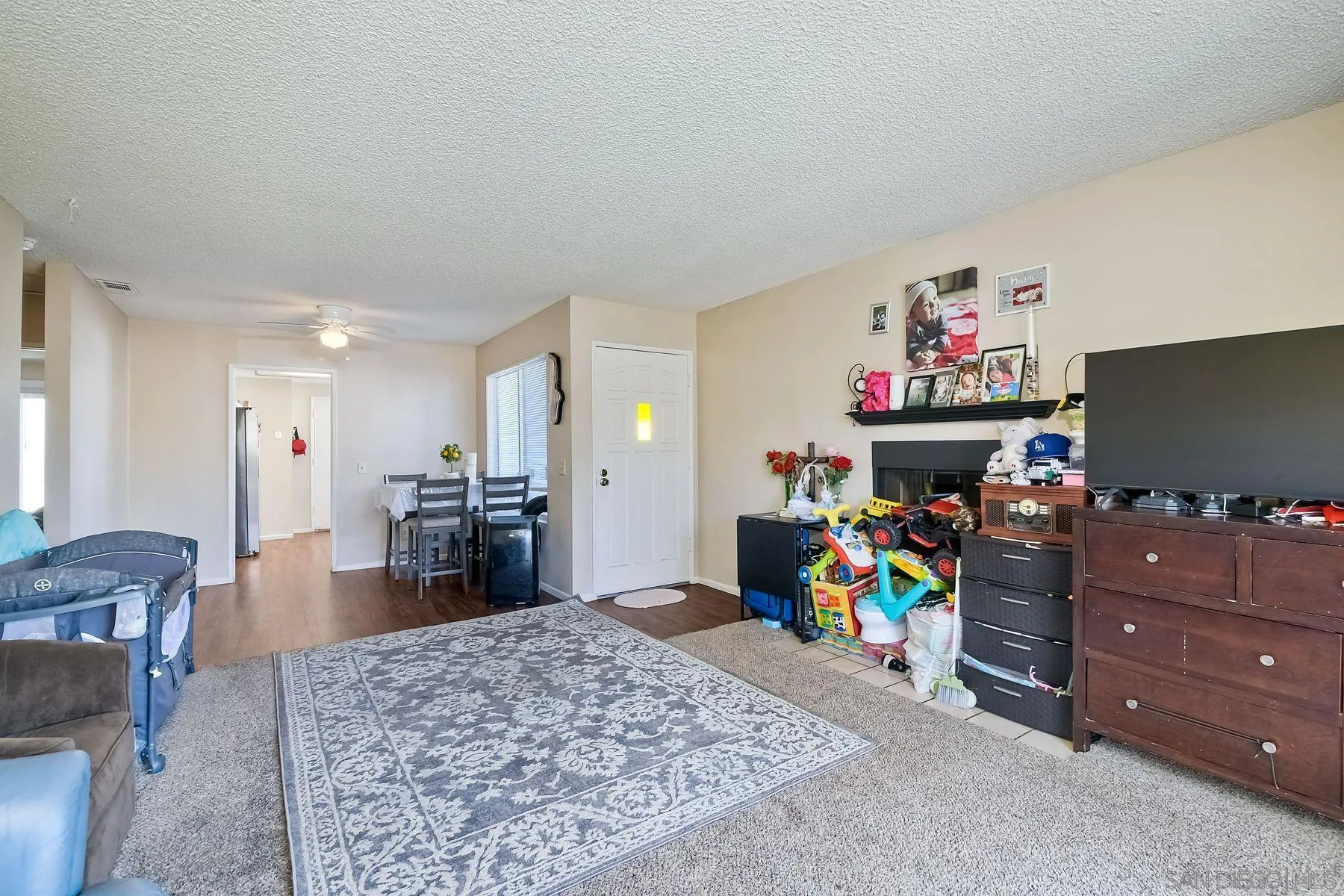1160 Corral Glen Escondido, CA 92026 - Photo 4 of 16 a living room with furniture and a flat screen tv