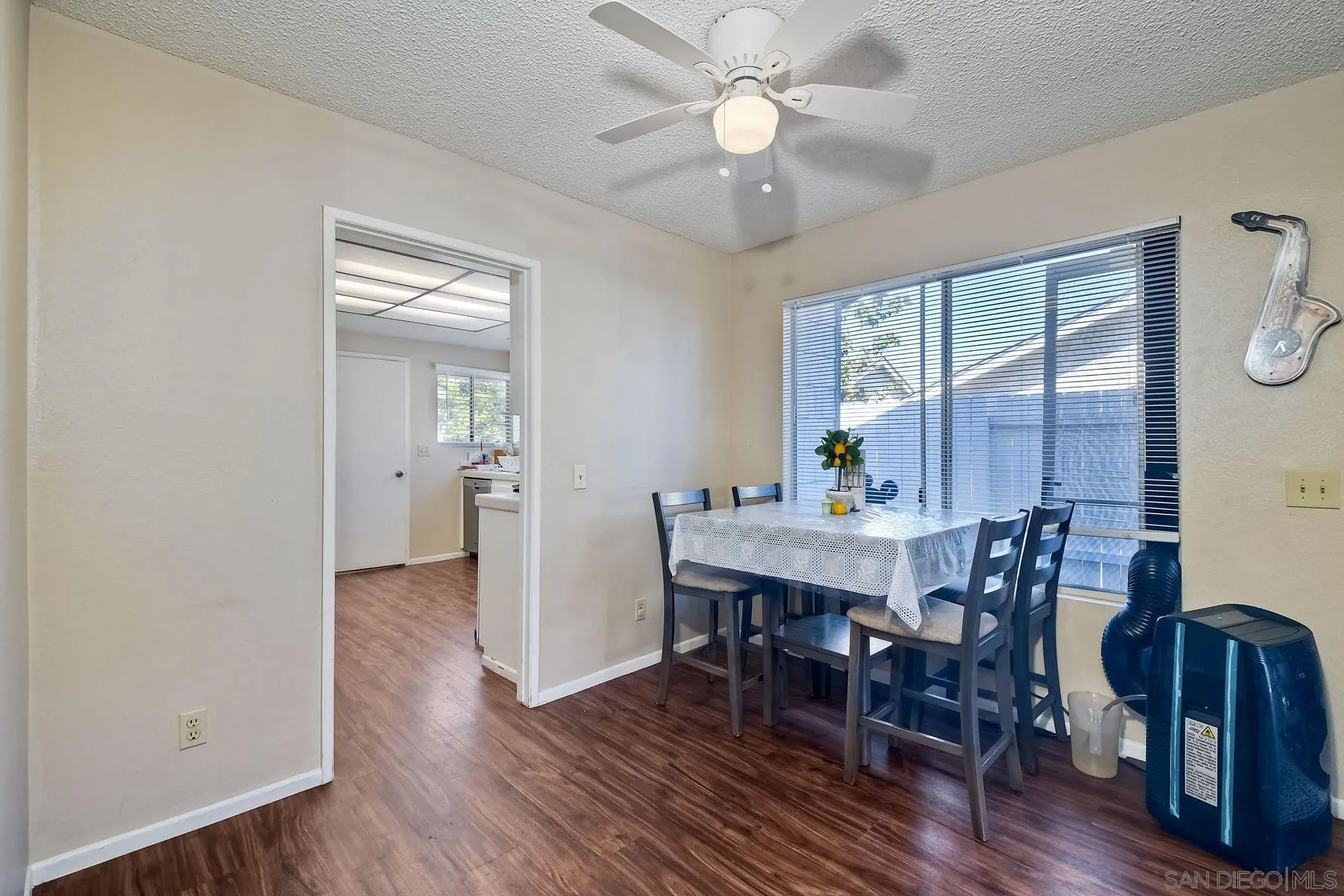 1160 Corral Glen Escondido, CA 92026 - Photo 5 of 16 a view of a dining room with furniture window and wooden floor