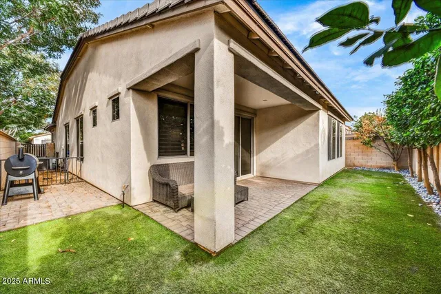 a backyard of a house with seating space