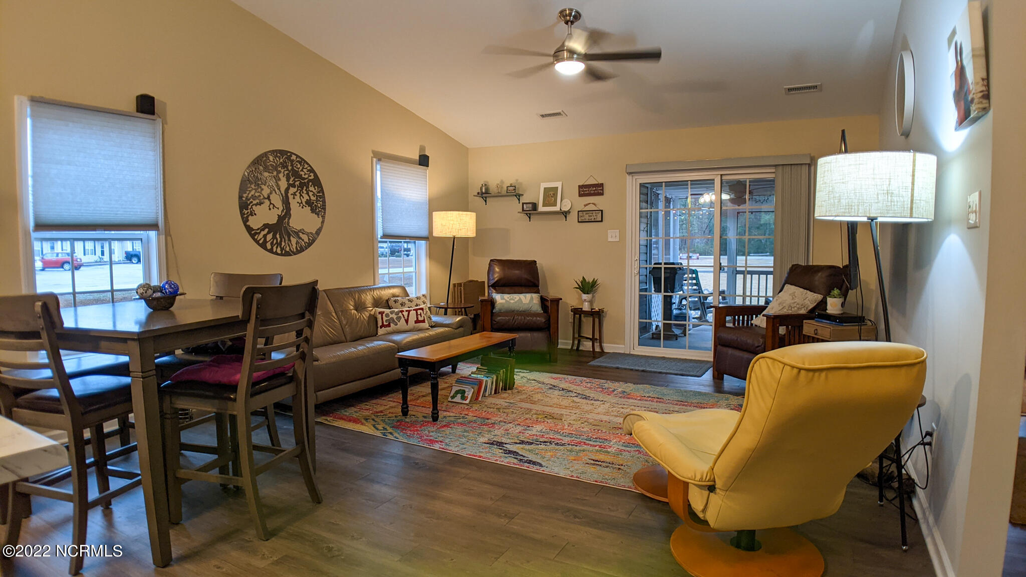 601 Peletier Loop Road, Unit B7 Swansboro, NC 28584 - Photo 7 of 19 Living room dining room combo with access to screened in back patio