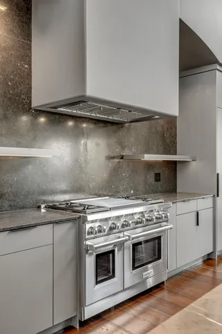 a bedroom with two beds and a large window