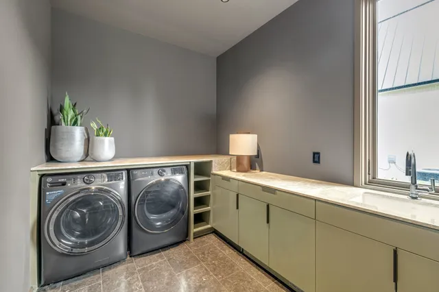 a bathroom with a granite countertop sink a toilet a mirror and shower
