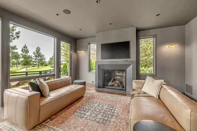 an aerial view of residential houses with yard and swimming pool