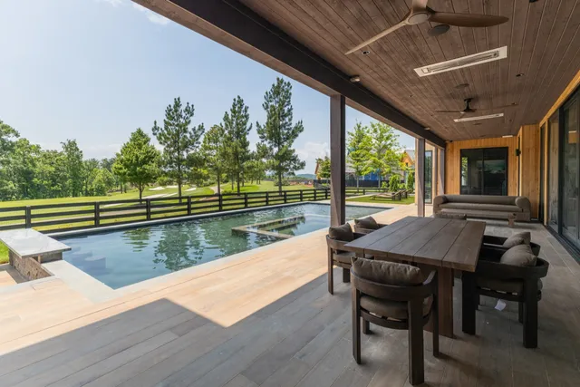 a view of a livingroom with furniture window and wooden floor