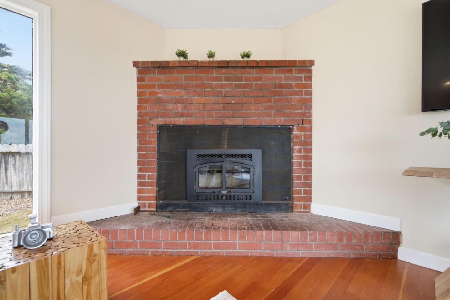 1263 Reservoir Road Pescadero, CA 94060 - Photo 26 of 66 a view of fireplace and wooden floor