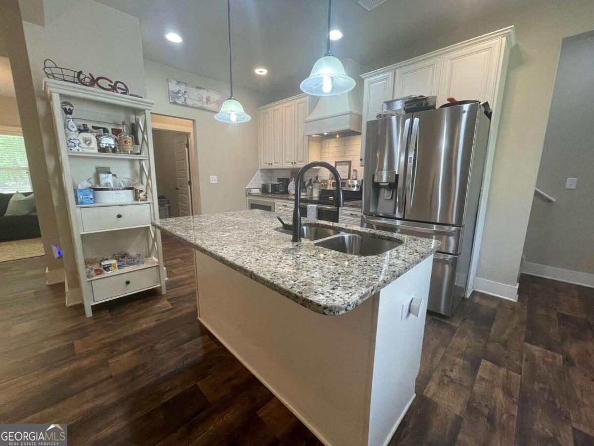 457 Old Good Hope Road Good Hope, GA 30641 - Photo 3 of 59 a kitchen with stainless steel appliances granite countertop a refrigerator and a sink
