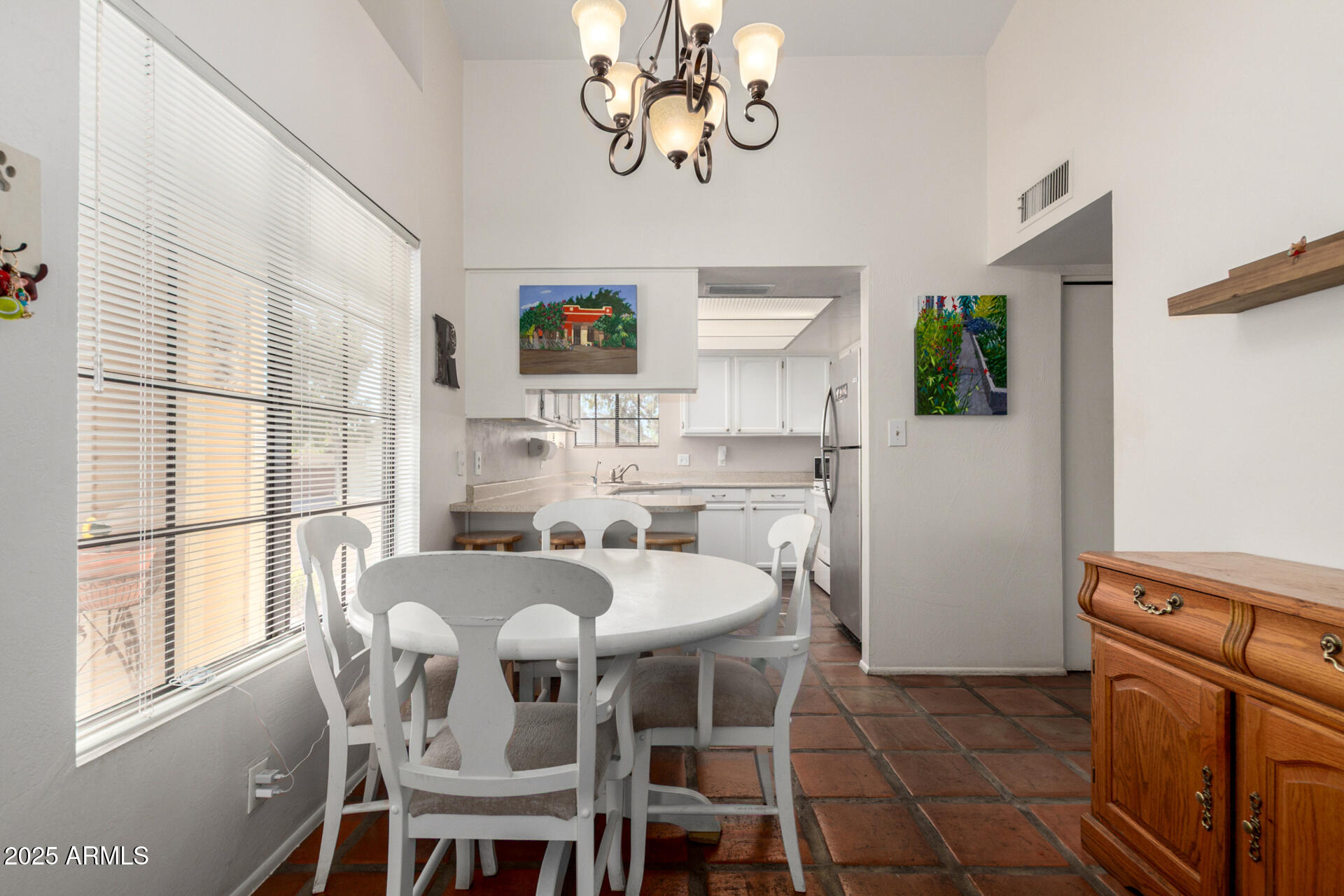 2455 East Broadway Road, Unit 73 Mesa, AZ 85204 - Photo 12 of 35 a view of a dining room with furniture window and outside view