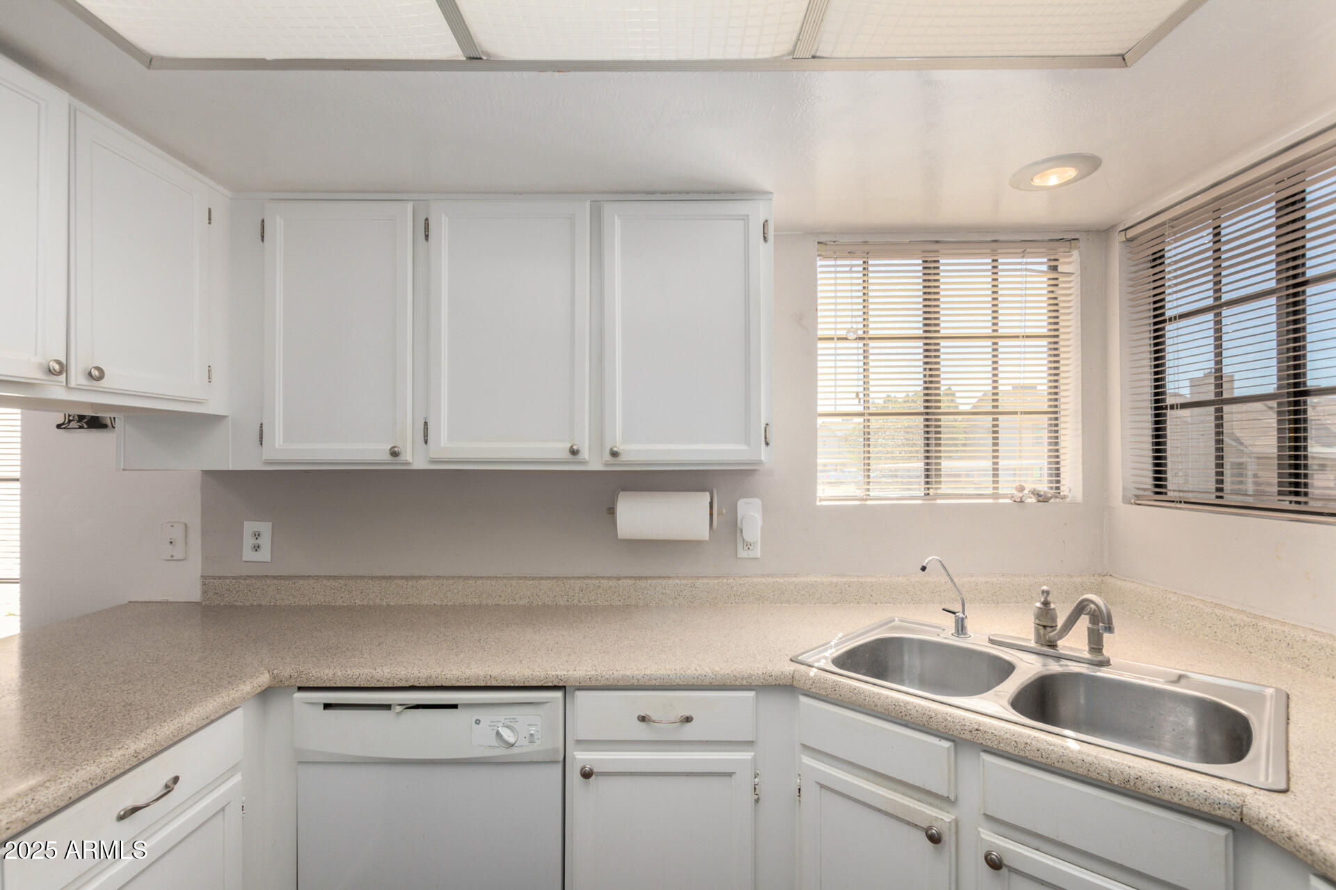 2455 East Broadway Road, Unit 73 Mesa, AZ 85204 - Photo 14 of 35 a kitchen with appliances cabinets and a sink