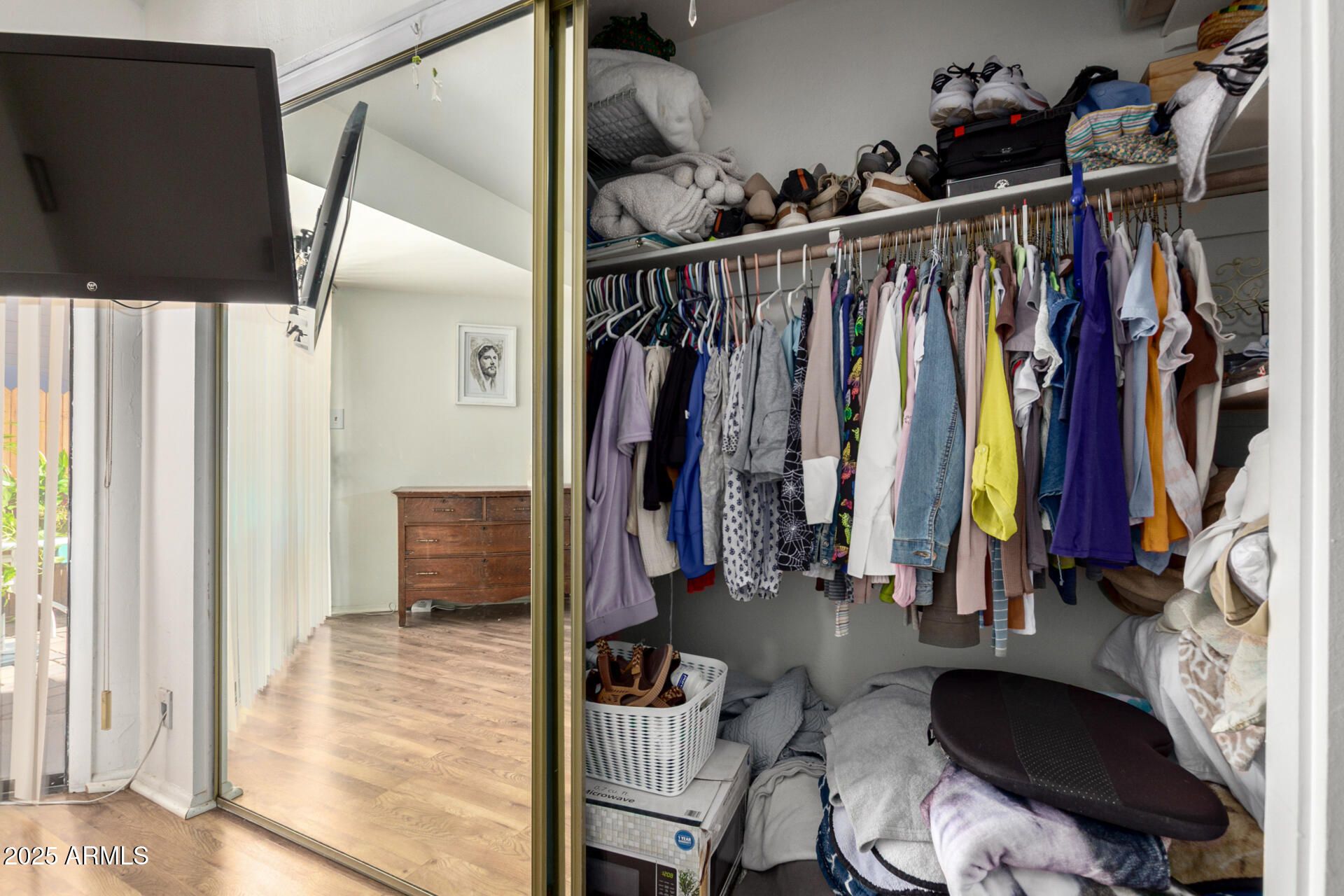 2455 East Broadway Road, Unit 73 Mesa, AZ 85204 - Photo 21 of 35 a view of walk in closet with clothes and shoes