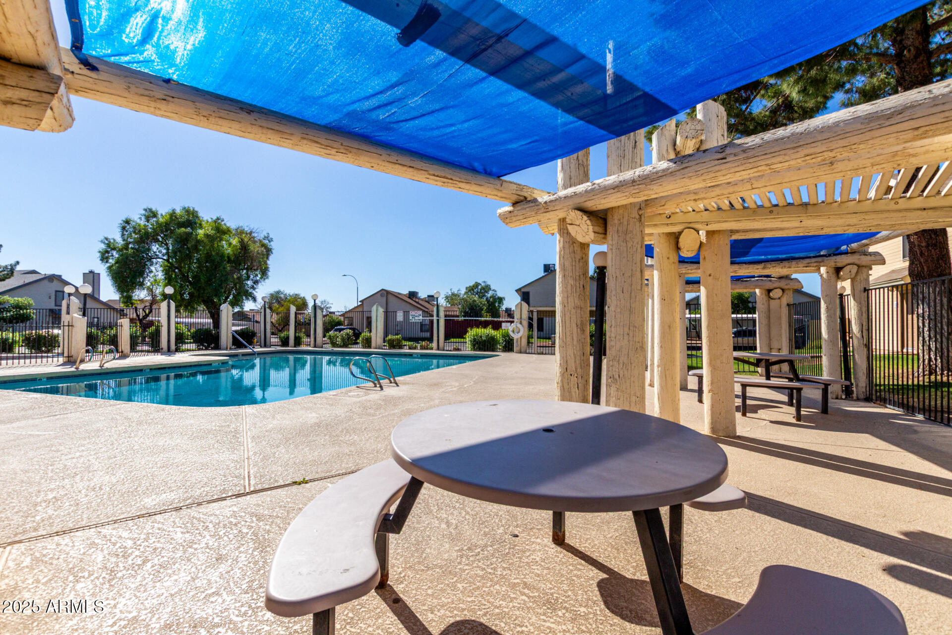2455 East Broadway Road, Unit 73 Mesa, AZ 85204 - Photo 35 of 35 a view of a chairs and table in patio with a barbeque