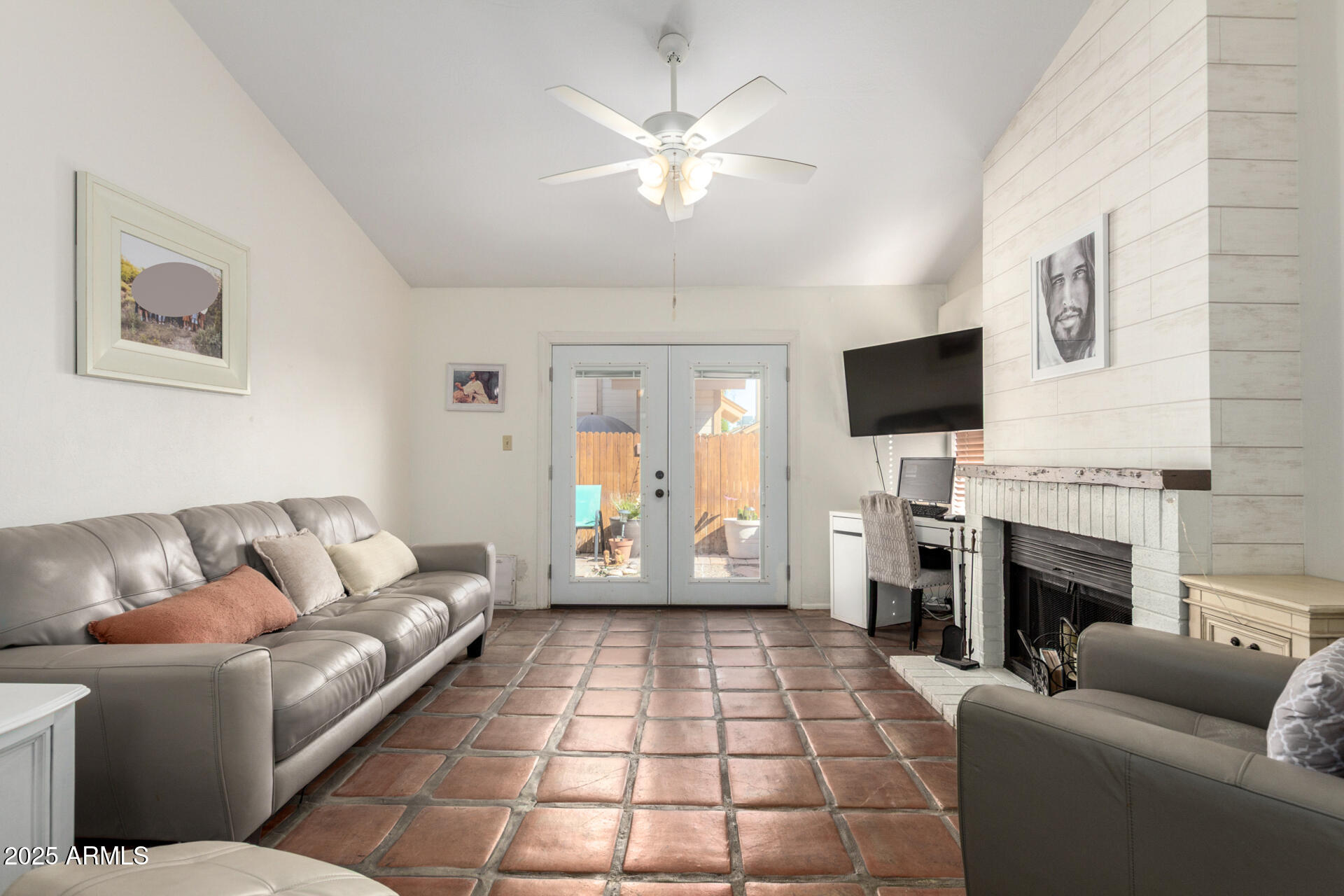 2455 East Broadway Road, Unit 73 Mesa, AZ 85204 - Photo 7 of 35 a living room with furniture a fireplace and a flat screen tv