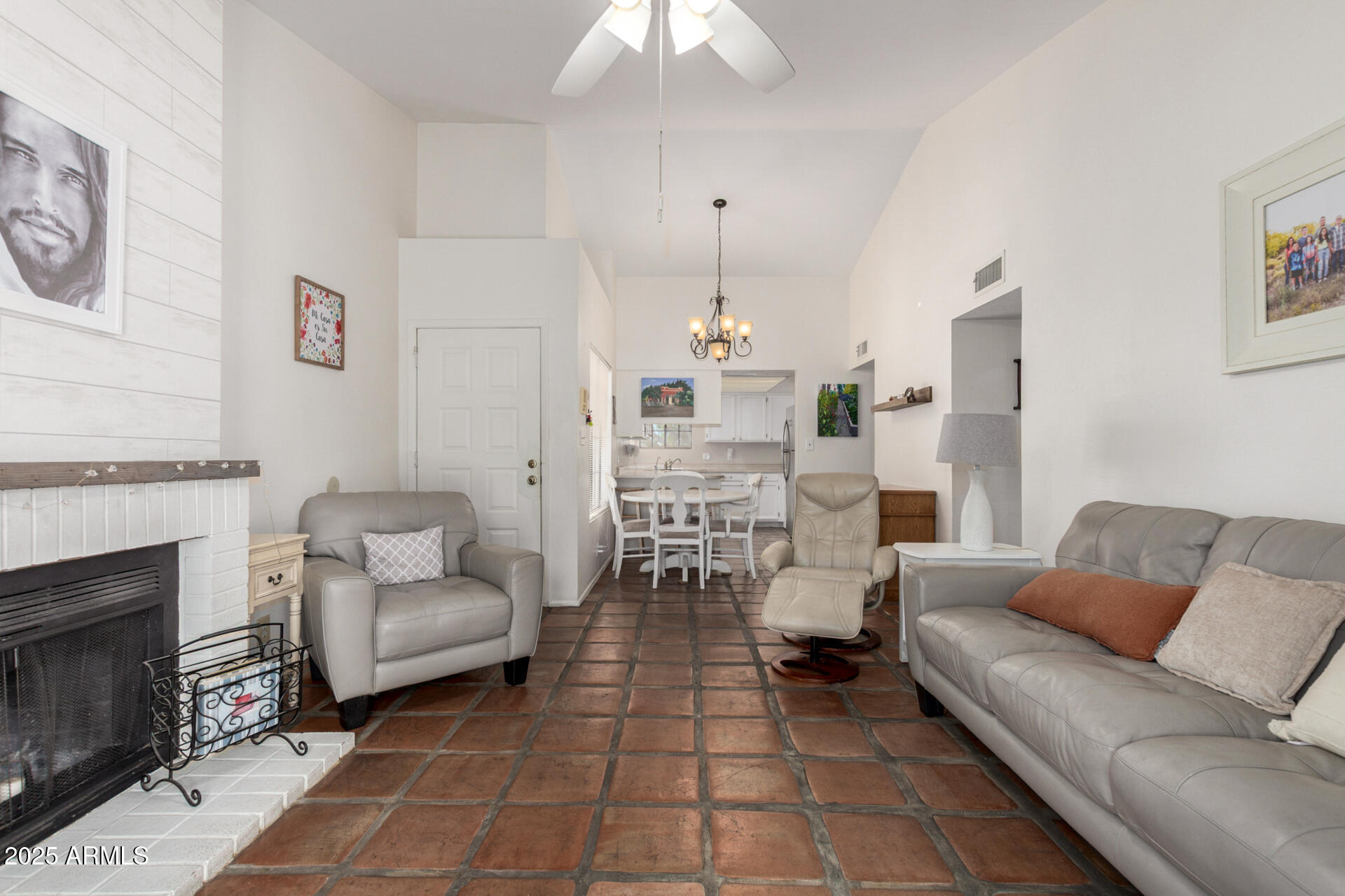 2455 East Broadway Road, Unit 73 Mesa, AZ 85204 - Photo 8 of 35 a living room with furniture and a fireplace