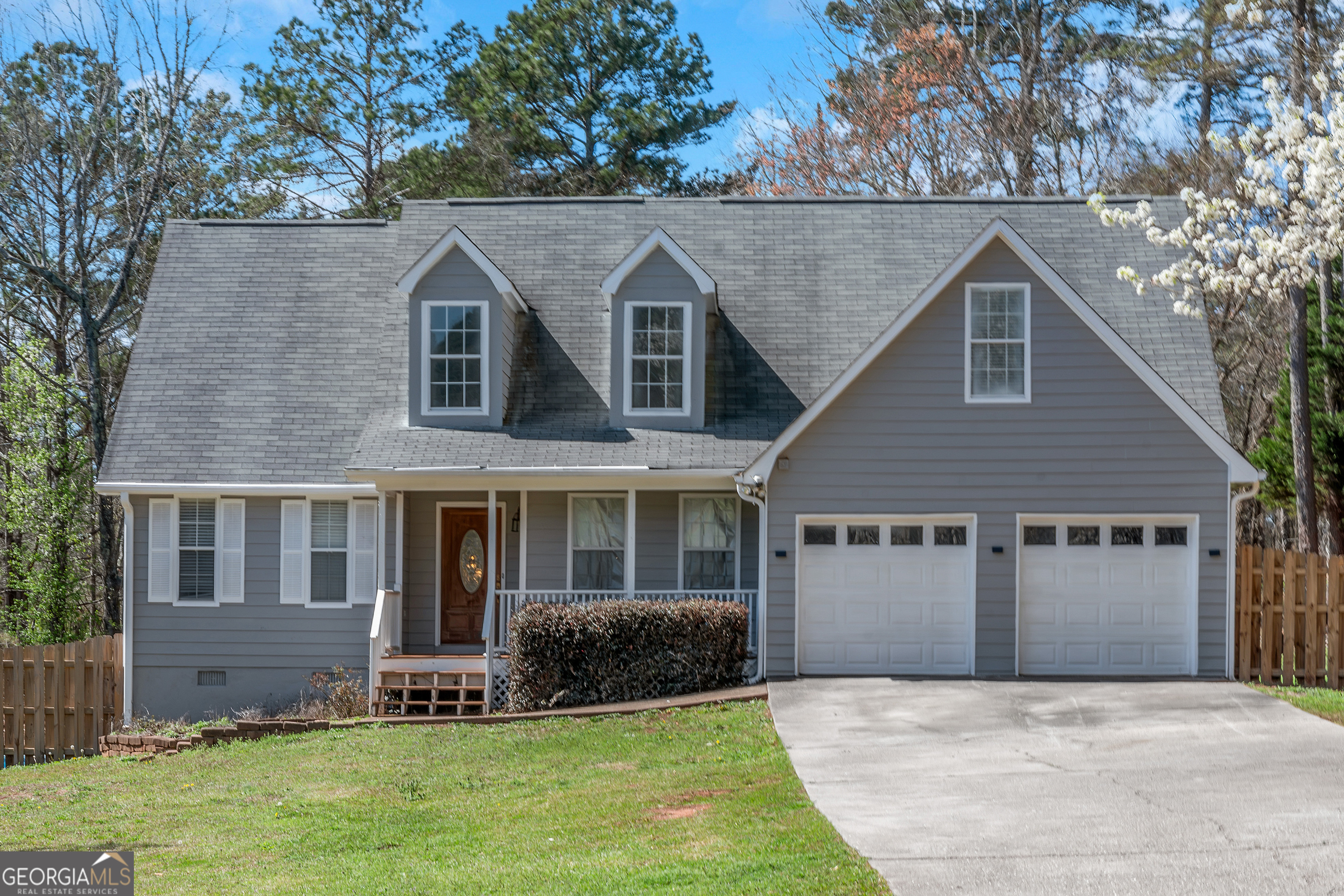 926 Locust Road Locust Grove, GA 30248 - Photo 1 of 1 a front view of house with yard and green space