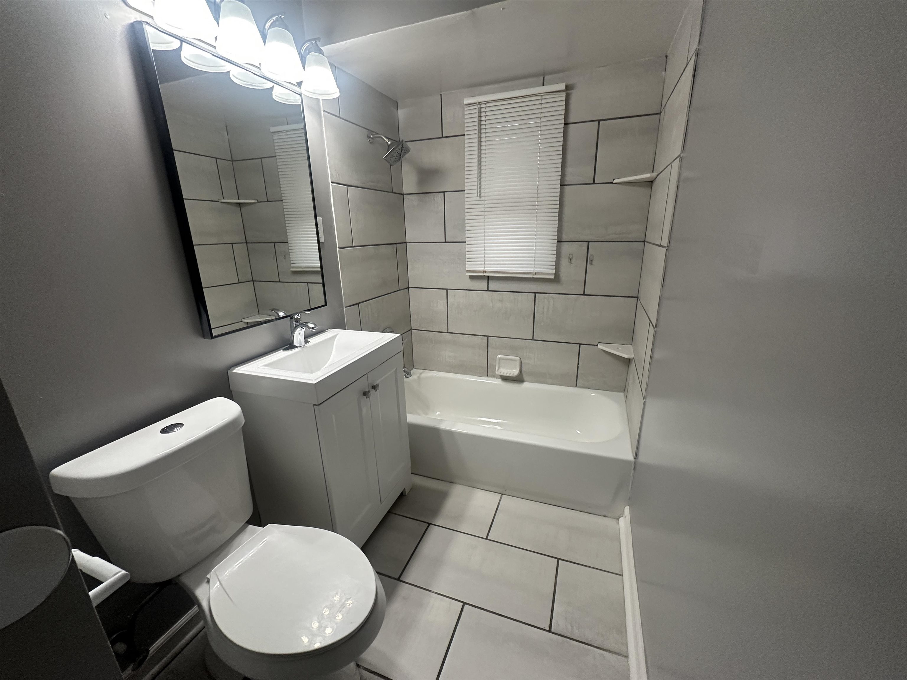 1285 Old Hickory Road Memphis, TN 38116 - Photo 22 of 31 Bathroom with tile patterned flooring, shower / tub combination, vanity, and toilet