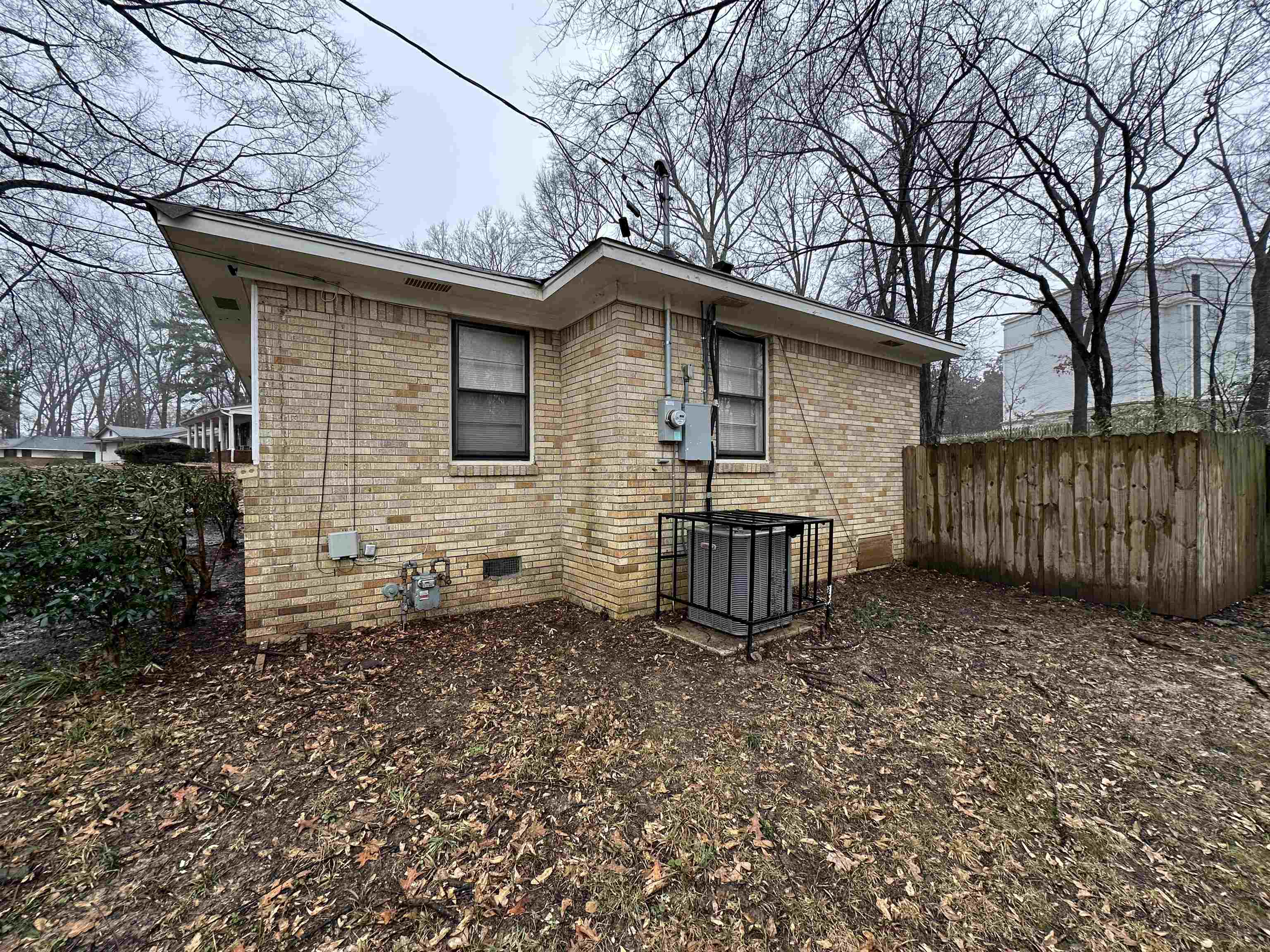 1285 Old Hickory Road Memphis, TN 38116 - Photo 27 of 31 View of home's exterior with brick siding, crawl space, and fence