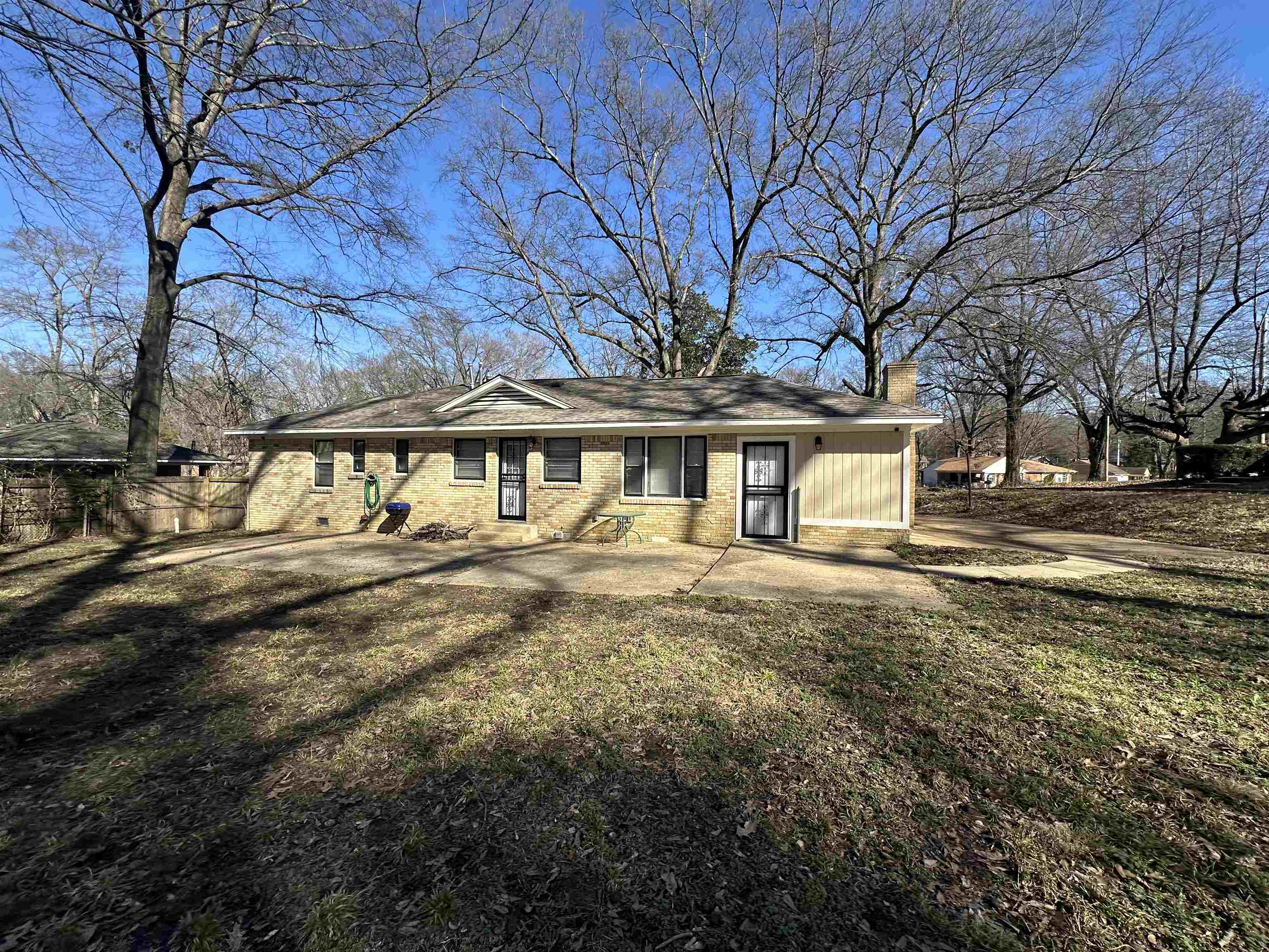 1285 Old Hickory Road Memphis, TN 38116 - Photo 31 of 31 View of front facade with a front yard, a patio area, brick siding, and a chimney