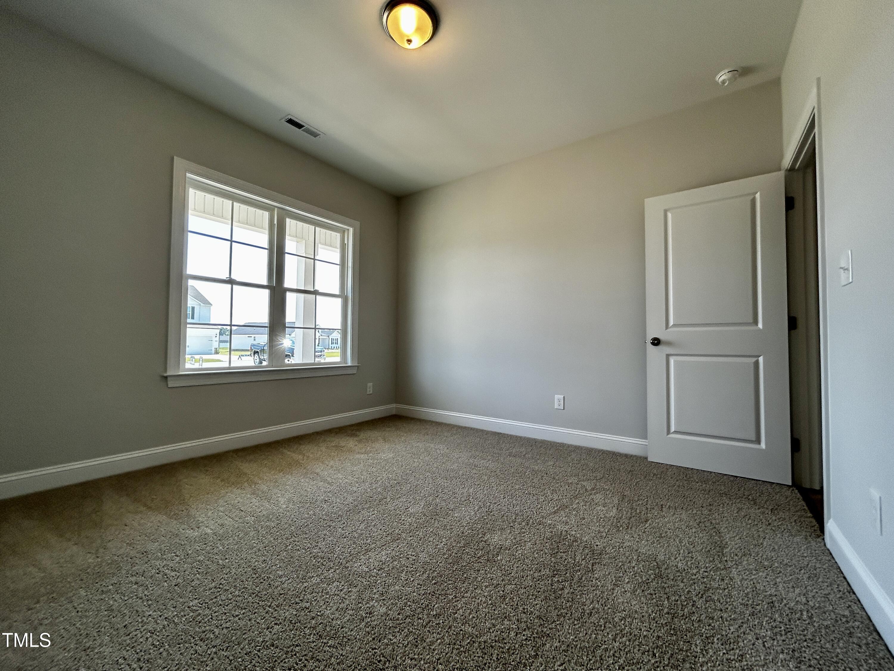 3912 Origin Drive Bailey, NC 27807 - Photo 18 of 20 an empty room with windows