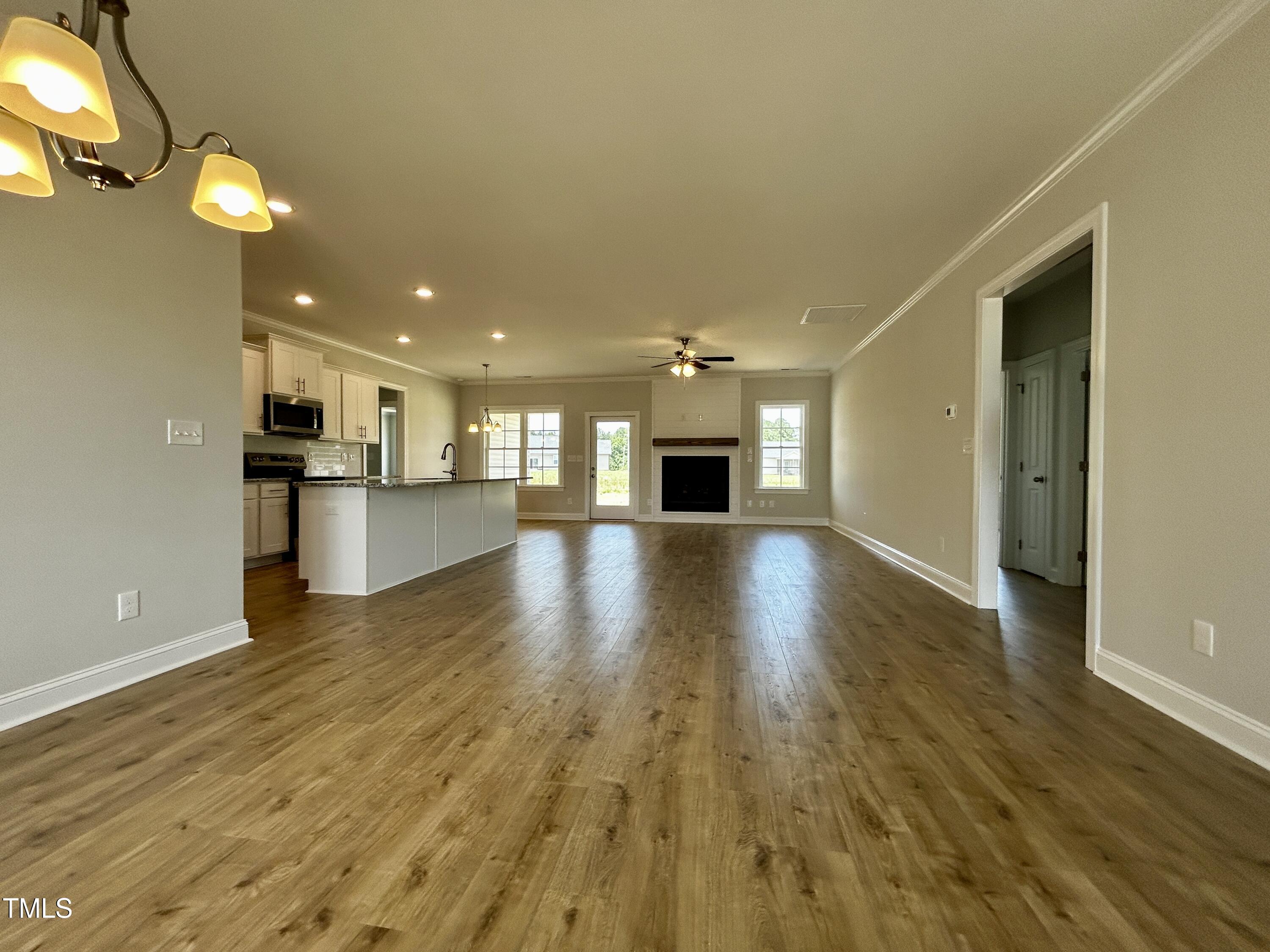 3912 Origin Drive Bailey, NC 27807 - Photo 3 of 20 a view of a kitchen with a sink and a refrigerator