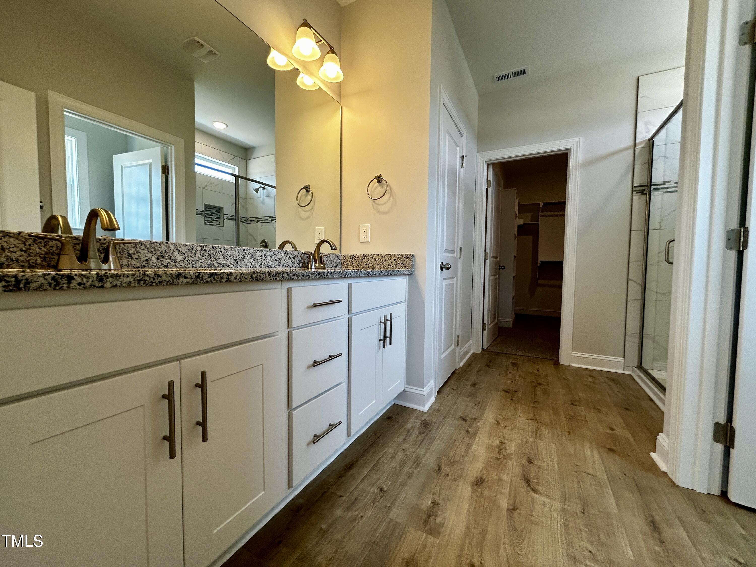 3912 Origin Drive Bailey, NC 27807 - Photo 10 of 20 a spacious bathroom with a sink and a mirror