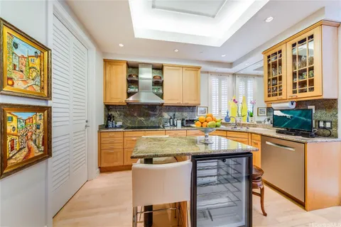 a kitchen with stainless steel appliances granite countertop sink stove and granite counter top