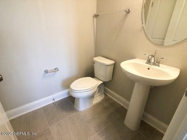 13991 Molina Drive Jacksonville, FL 32256 - Photo 11 of 34 a bathroom with a sink toilet and a mirror