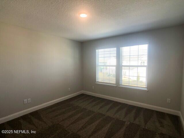 13991 Molina Drive Jacksonville, FL 32256 - Photo 14 of 34 an empty room with wooden floor and windows