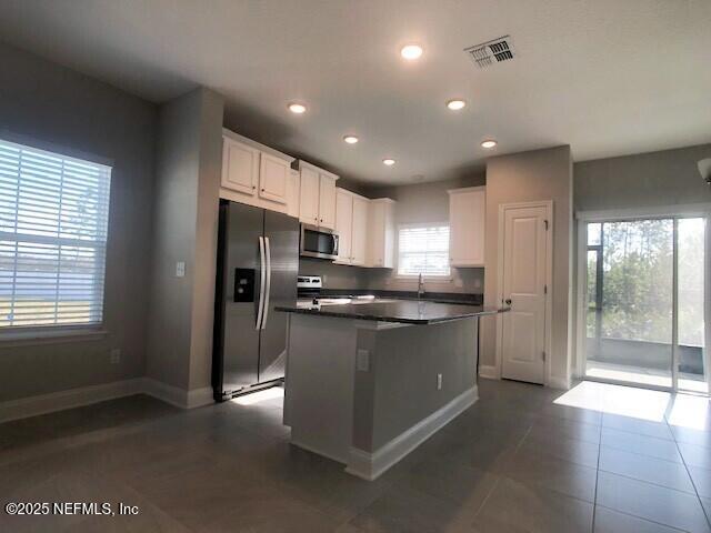13991 Molina Drive Jacksonville, FL 32256 - Photo 3 of 34 a kitchen with stainless steel appliances granite countertop a refrigerator and a stove