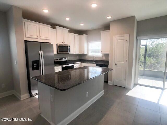 13991 Molina Drive Jacksonville, FL 32256 - Photo 5 of 34 a kitchen with stainless steel appliances granite countertop a refrigerator a sink a stove a microwave and island