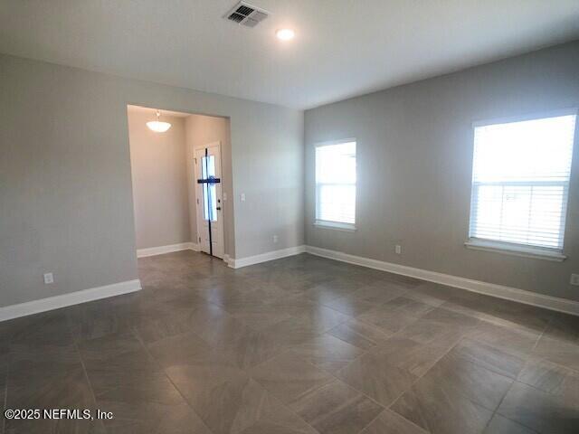 13991 Molina Drive Jacksonville, FL 32256 - Photo 10 of 34 an empty room with windows and closet
