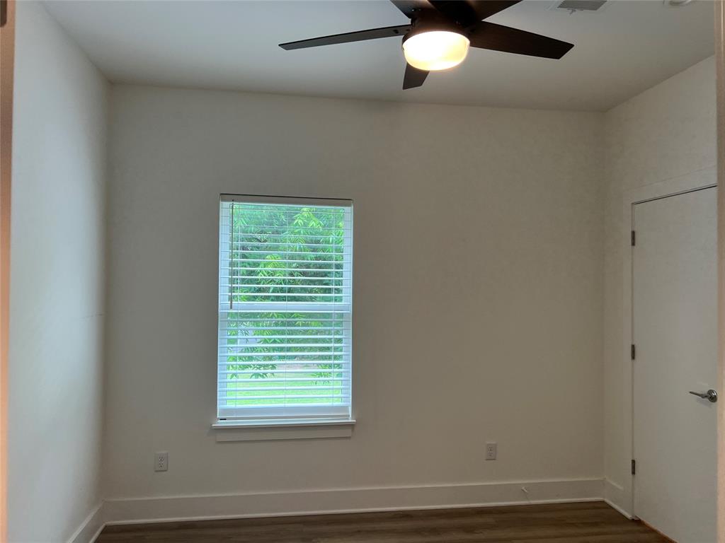 408 Martin Luther King Junior Boulevard, Unit 401 Waxahachie, TX 75165 - Photo 12 of 15 an empty room with a window