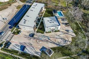 408 Martin Luther King Junior Boulevard, Unit 401 Waxahachie, TX 75165 - Photo 14 of 15 an aerial view of a house with a yard