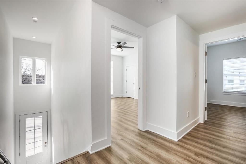408 Martin Luther King Junior Boulevard, Unit 401 Waxahachie, TX 75165 - Photo 3 of 15 an entryway with wooden floor and cabinet