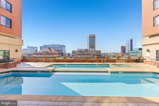 a multi story building with view of city view