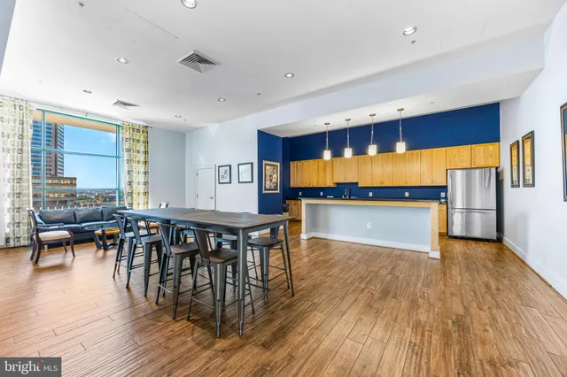 a view of a dining room with furniture and wooden floor